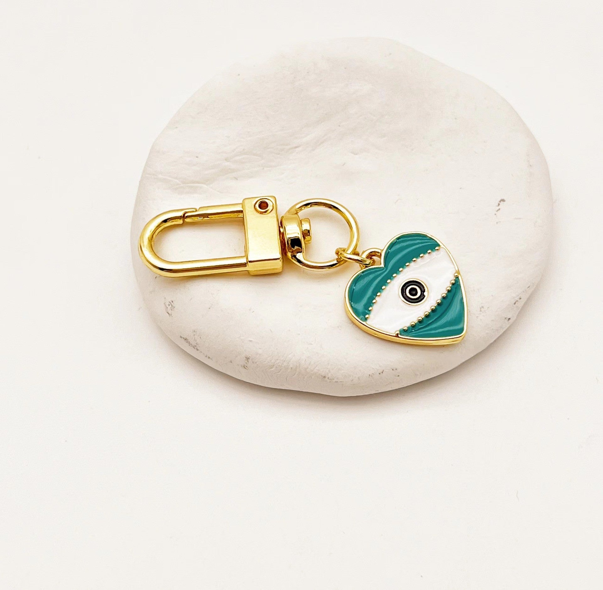 Venta al por mayor Llaveros De La Aleación Del Corazón Del Ojo Del Diablo